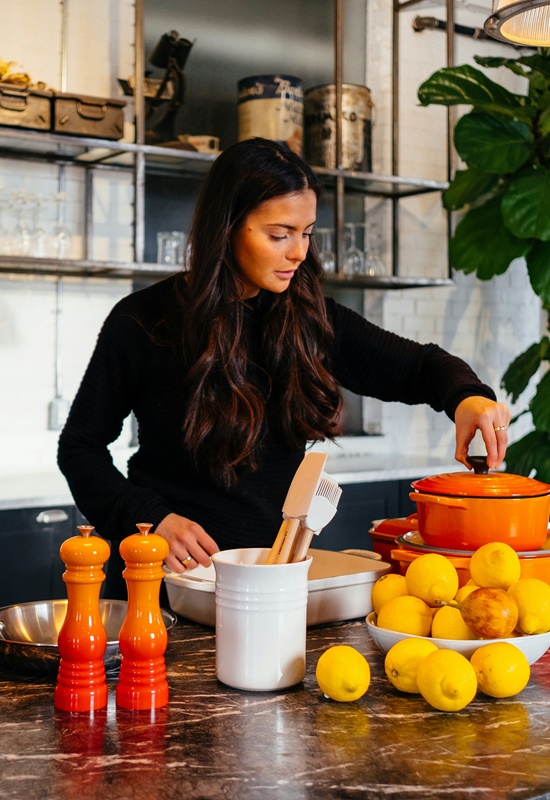 Woman cooking healthy food in a beautiful kitchen